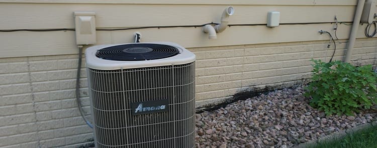 exhaust pipes sticking outside of house near air conditioner