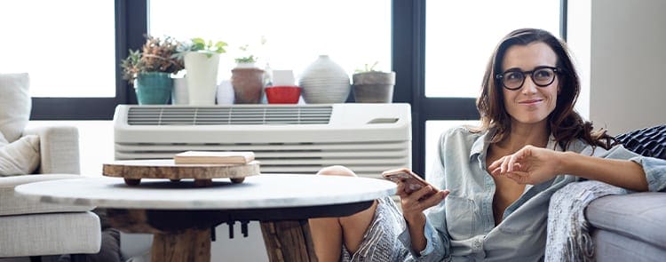 woman on her cell phone lounging on the floor