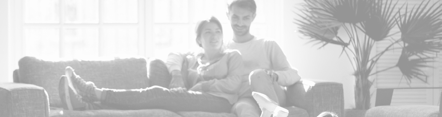 young family with child reading a book